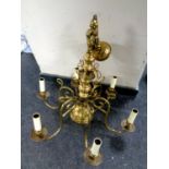 A brass six branch chandelier