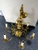 A brass six branch chandelier