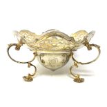 A good quality silver gilt pierced dish raised on shell pad feet