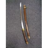 A 20th century Japanese katana in scabbard