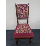 An antique mahogany tapestry upholstered bedroom chair