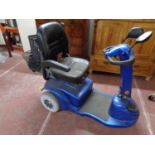 A mobility cart with charger and keys (as found),