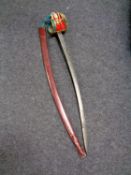 A 20th century Scottish basket hilt sword in leather scabbard (as found)