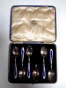 A set of five cased Birmingham silver and enamelled teaspoons together with one further damaged