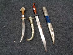 Two 20th century Persian knives in scabbards