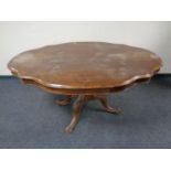 A shaped Victorian pedestal breakfast table