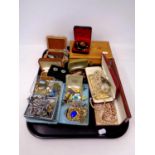 A tray containing a quantity of costume jewellery to include simulated pearls, brooches, cuff links,