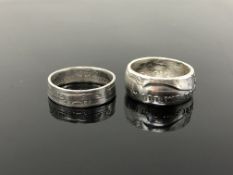 A United States silver dollar ring together with one other 19th century silver ring