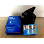 A Polaroid camera in bag together with Polaroid image system camera and image system special