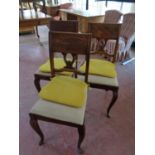 A set of six continental oak dining chairs,