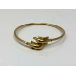 A 14ct gold dolphin bangle CONDITION REPORT: 7.5g.
