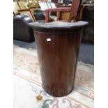 A 19th century mahogany cylindrical fronted corner cabinet