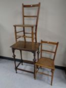 A pair of Edwardian bedroom chairs together with an Edwardian oak occasional table