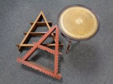 Two triangular wall shelves together with a mahogany wine table with a leather inset panel