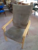 A wood framed high backed adjustable armchair upholstered in a suede fabric