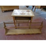 A blonde oak wall shelf together with a blonde oak tile topped occasional table