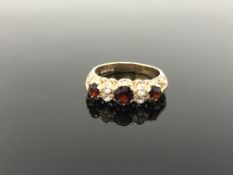 A 9ct gold garnet set ring, size P CONDITION REPORT: 3.