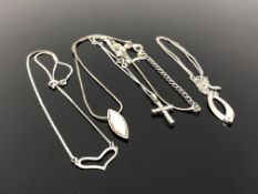 Four silver pendants and chains