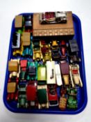A tray containing die cast vehicles by Lesney and Matchbox classic cars together with a wooden