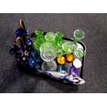 A tray containing antique and later glassware to include green glass trinket set,