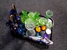 A tray containing antique and later glassware to include green glass trinket set,