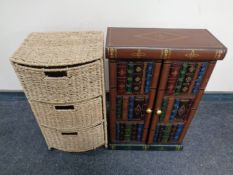 A contemporary double door cabinet in the form of books together with a metal and sea grass three