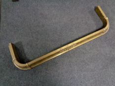 A 19th century brass fire curb