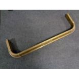 A 19th century brass fire curb