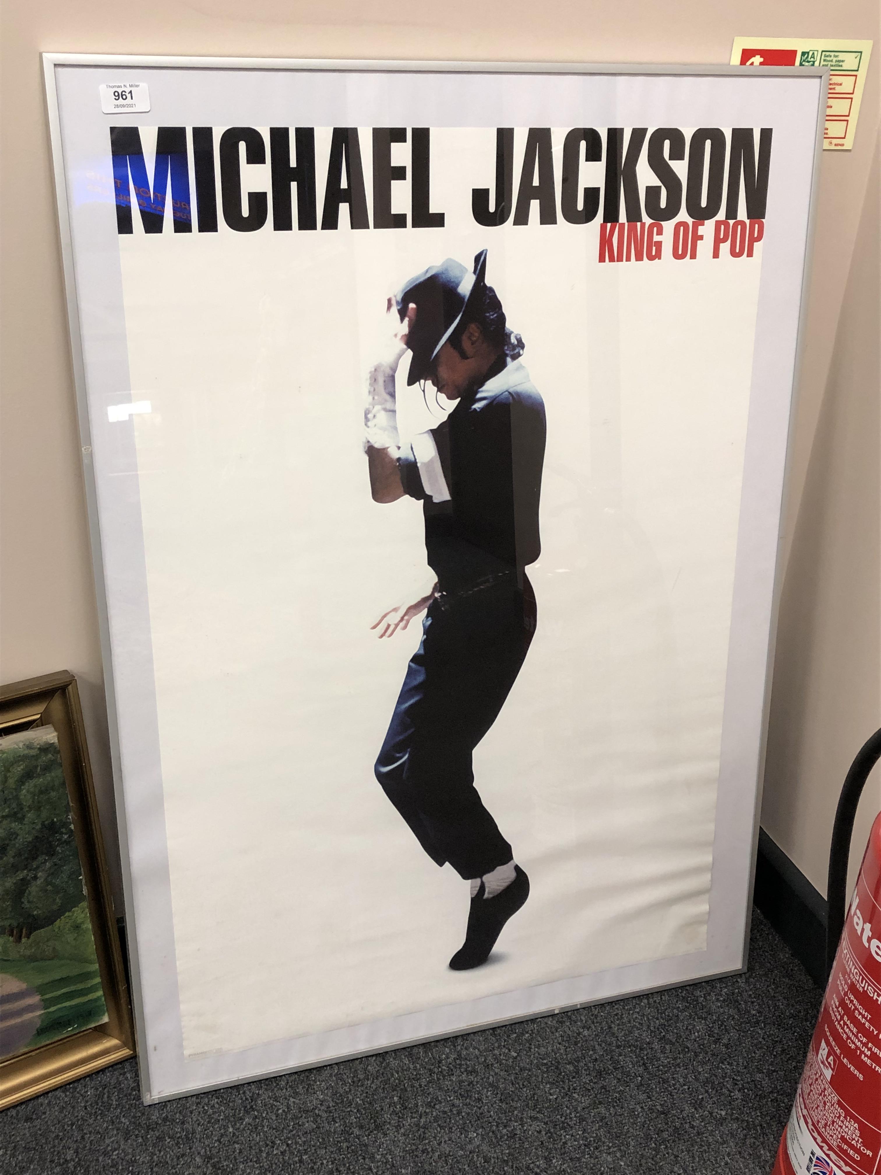 A framed poster : Michael Jackson King of Pop,