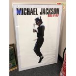 A framed poster : Michael Jackson King of Pop,