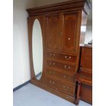 A late Victorian inlaid mahogany compactum wardrobe