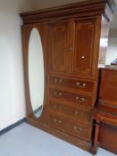 A late Victorian inlaid mahogany compactum wardrobe