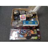 A box containing assorted toys to include Light Strike gun and launch systems, Furby,