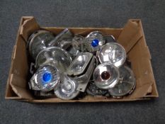 A box of vintage car head lamps