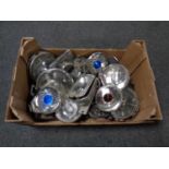 A box of vintage car head lamps