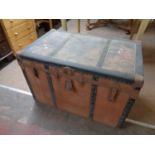 An antique metal bound shipping trunk