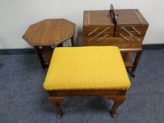 A 20th century oak concertina sewing box together with an upholstered dressing table stool and an