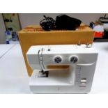 A Janome Model 1560 electric sewing machine in original box