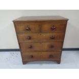 A George III oak five drawer chest