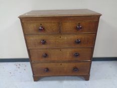 A George III oak five drawer chest