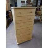 A contemporary pine six drawer chest