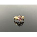 A 15ct gold ruby and seed pearl ring