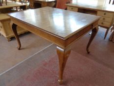 An antique oak dining table fitted two drawers on cabriole legs (as found)