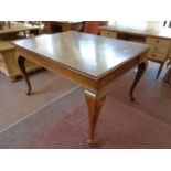 An antique oak dining table fitted two drawers on cabriole legs (as found)