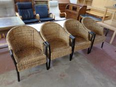 A set of four wicker conservatory armchairs
