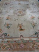 A Chinese floral embossed carpet on cream ground 490 x 372 cm