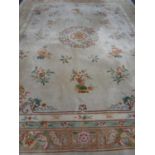 A Chinese floral embossed carpet on cream ground 490 x 372 cm