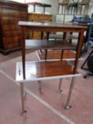 A pair of mid 20th century Danish two tier side tables together with a pair of tea trolleys on