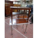 A pair of mid 20th century Danish two tier side tables together with a pair of tea trolleys on