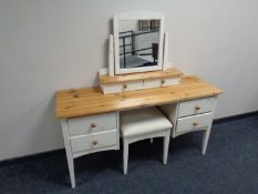 A pine topped four drawer dressing table on painted base with stool and mirror